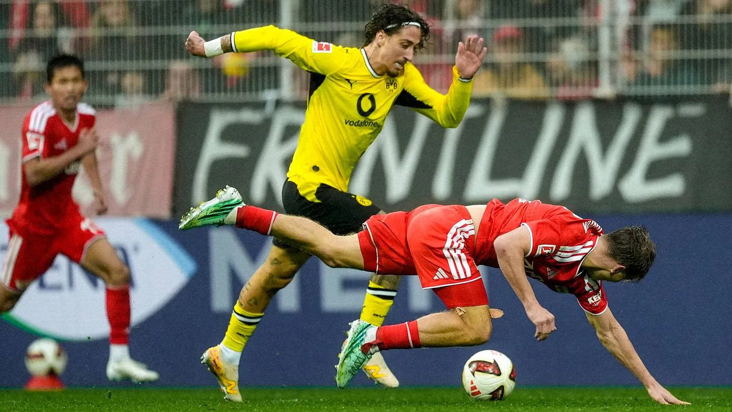 Union Berlin and Borussia Dortmund players challenge for the ball. Photo: Getty Images, via BVB Buzz