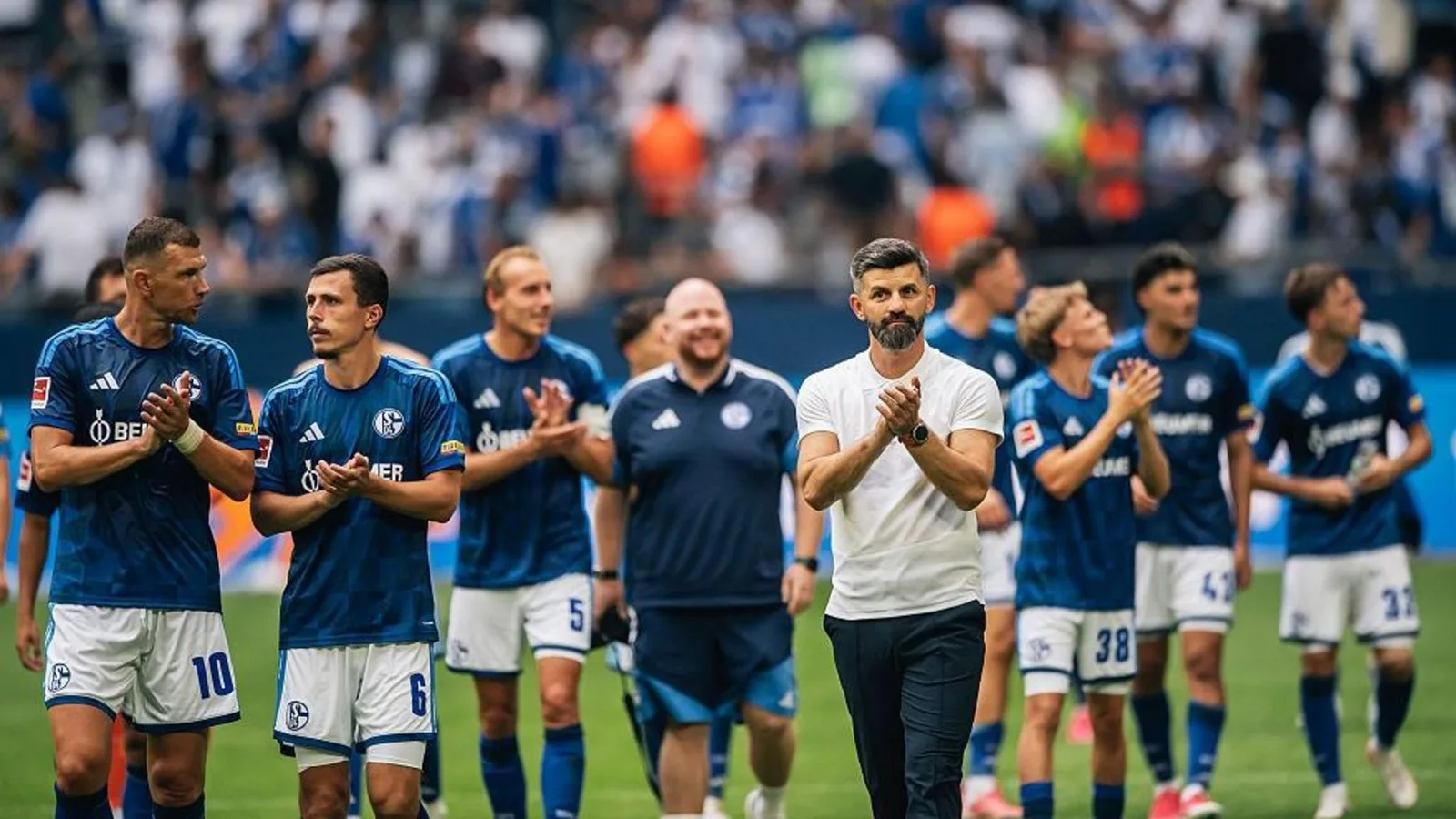 Schalke manager Miron Muslic and his players applaud the fans. Photo: BBC Sport
